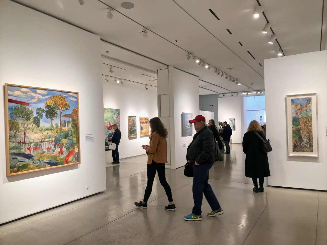 A vibrant sculpture exhibition with diverse artworks displayed in a spacious gallery setting, showcasing contemporary and traditional sculptures.